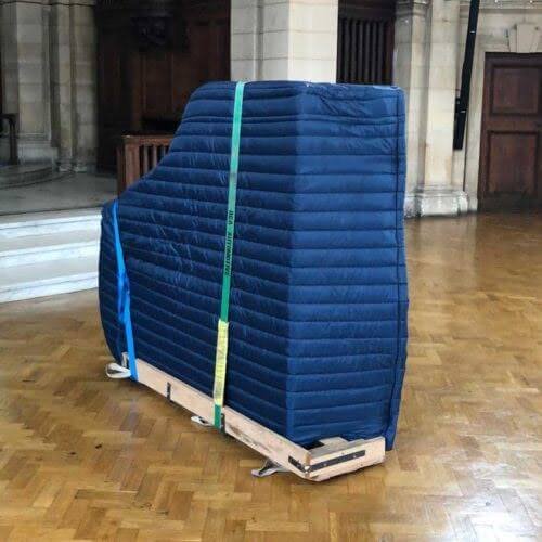 a piano packed before moving